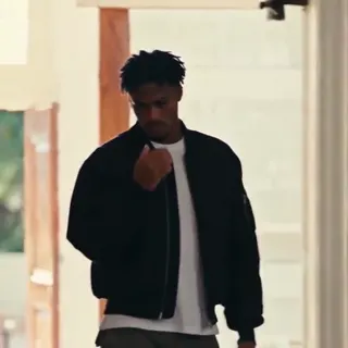 0:04–0:09 — The figure walks forward and makes the sign-of-the-cross gesture, touching face and chest.
